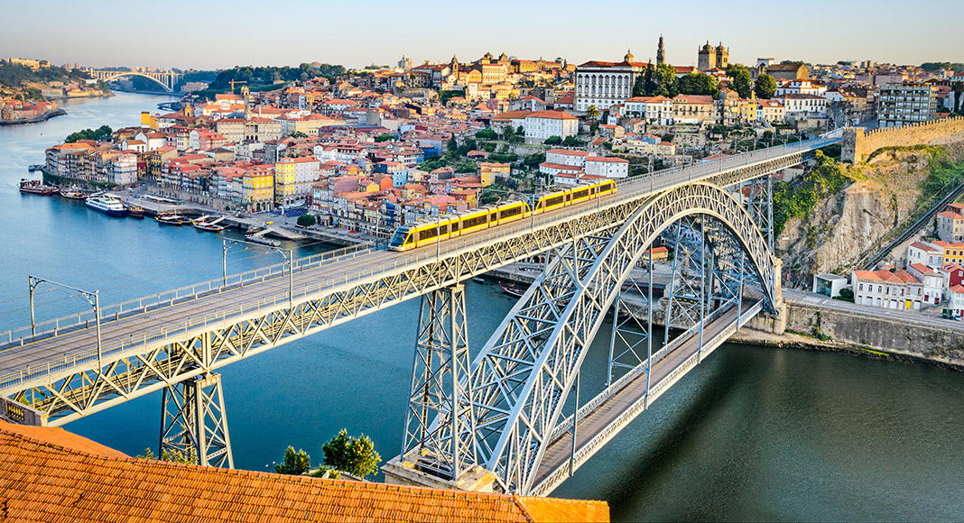shutterstock_148234274_View-of-the-historic-city-of-Porto-Portugal-with-the-Dom-Luiz-bridge.-A-metro-train-can-be-seen-on-the-bridge.jpg